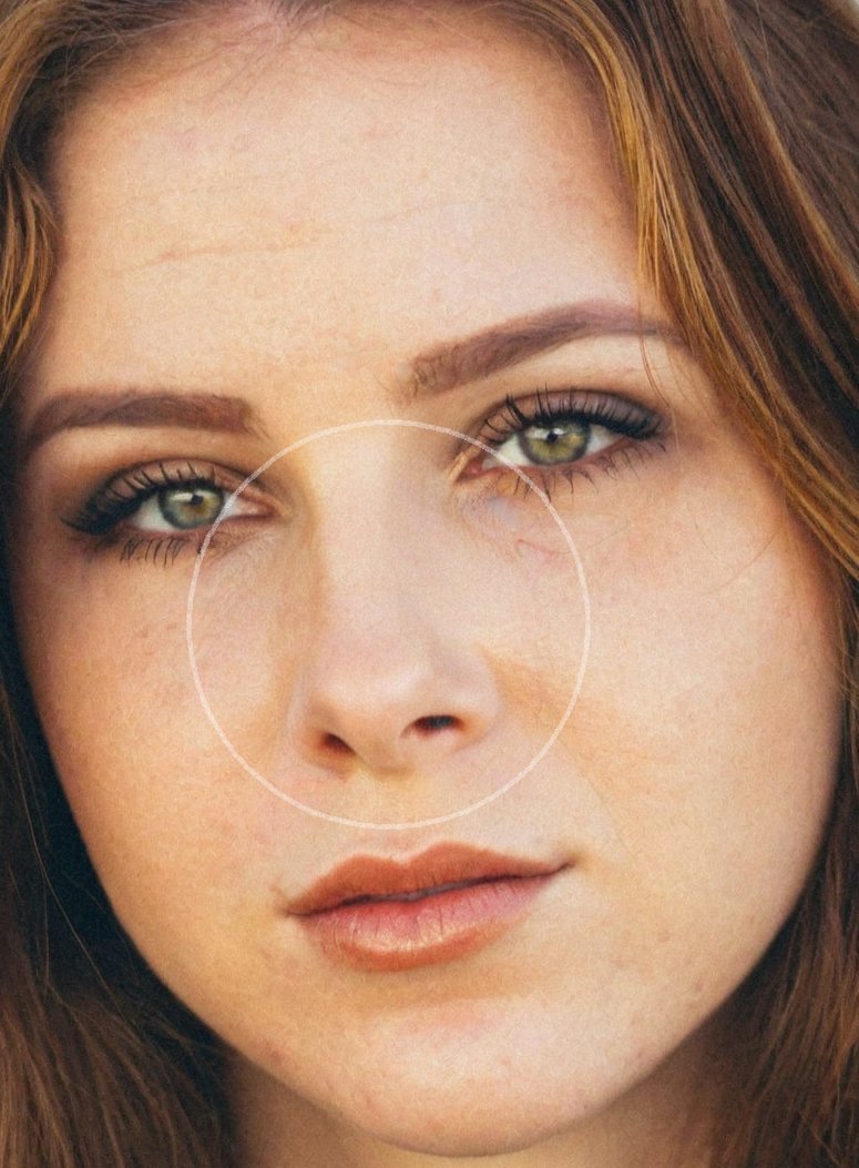 After: Before and after AI preview of a rhinoplasty made in Pody, red-haired woman with freckles, front view